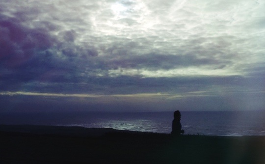 Bryony running along the cliff