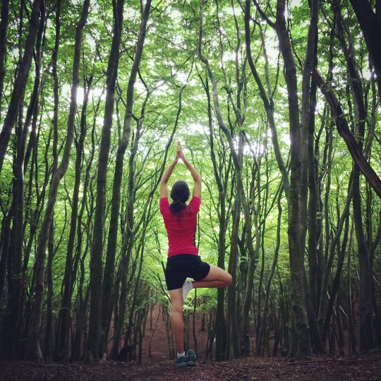 Rusty performing Tree Pose, yoga in the forest